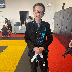 AVC student Carter Haynes poses at a Jiu Jitsu competition.